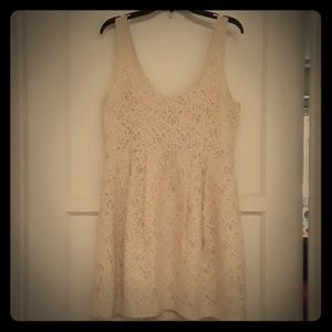 I'm selling a beautiful lace creme dress.